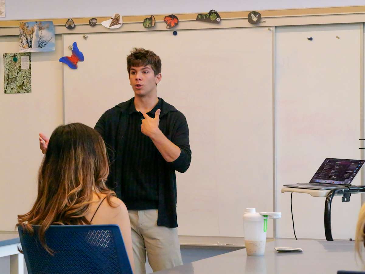 Students discuss environmental science research at Pomfret School.