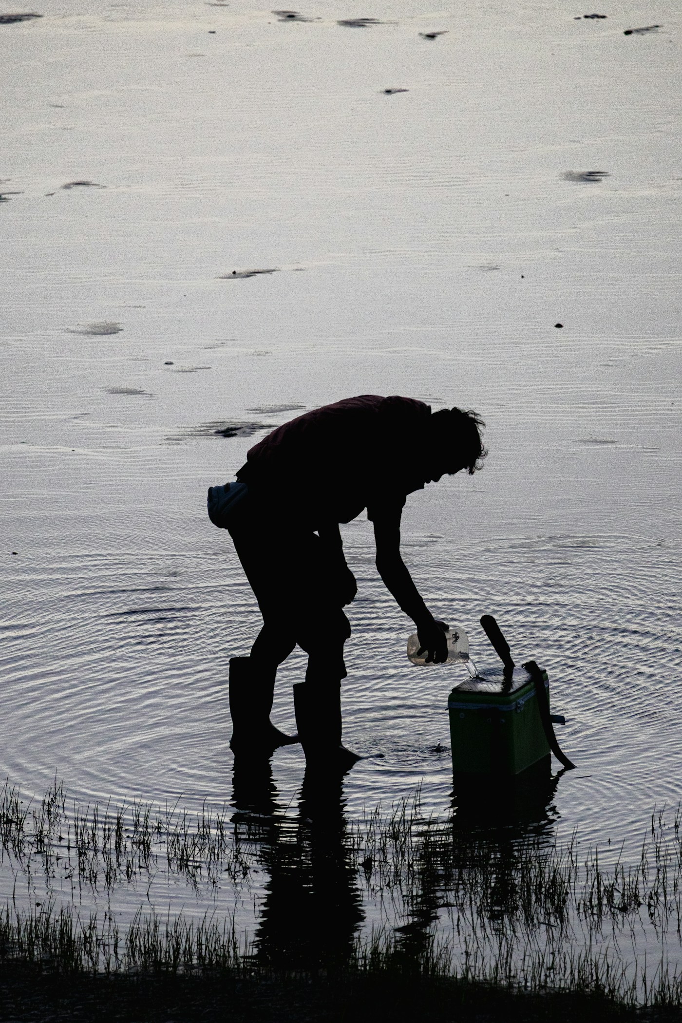 File photo: Person collecting a sample from a body of water; not the people, place or event in this story